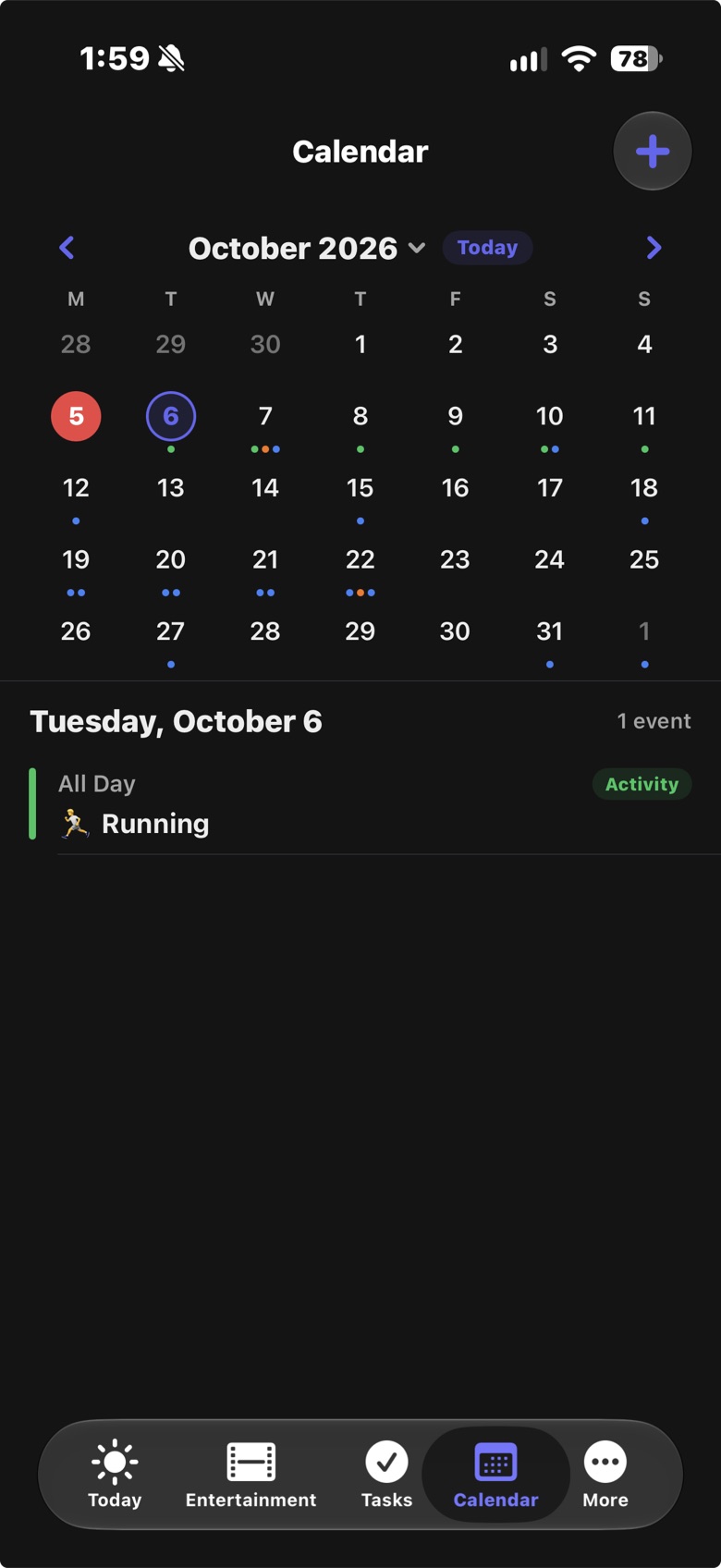 LifeOS on iPhone: a month calendar with a dot under each day that has events